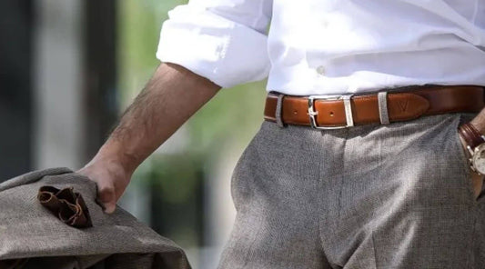 Man with a sienna brown belt with a light colored suit