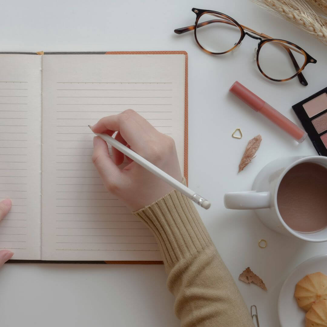 Overlay of a person writing a journal